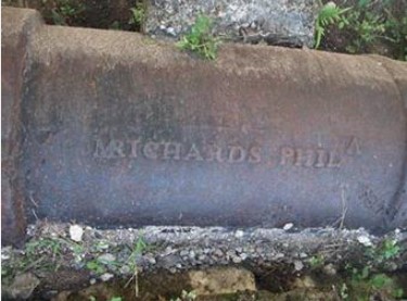  One of the
iron pipes cast in Philadelphia still in use, with the abbreviations of the name of the contractor and the city.