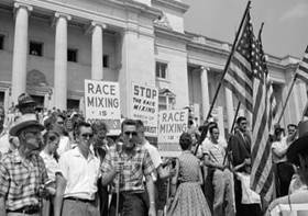 Protesters outside Central High, Little Rock Arkansas. In their posters they call for an end to the &ldquo;mix of races&rdquo;, stating that Integration would be a communist policy.
